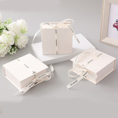 White Ribbon Logo Foldable Gift Box Make Up Clothes Accessories Rigid Paperboard With Glossy Lamination