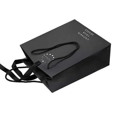 Custom Design Luxury Black Matte Thick Paper Clothing Packaging Gift Shopping Bag With Logo Ribbon And Handle