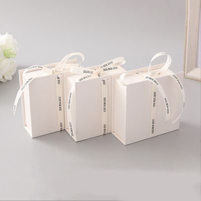 White Ribbon Logo Foldable Gift Box Make Up Clothes Accessories Rigid Paperboard With Glossy Lamination