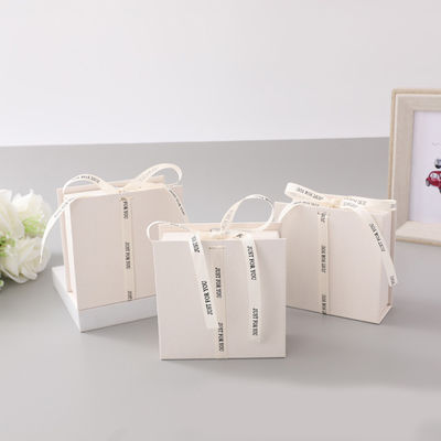 White Ribbon Logo Foldable Gift Box Make Up Clothes Accessories Rigid Paperboard With Glossy Lamination