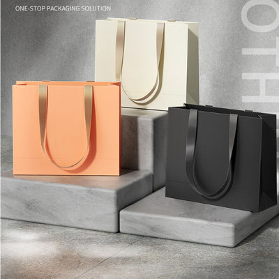 Custom Clothing Shopping Bags Packaging Luxury Ivory Board Kraft Paper Low Price  Shopping Gift Bag Custom Logo